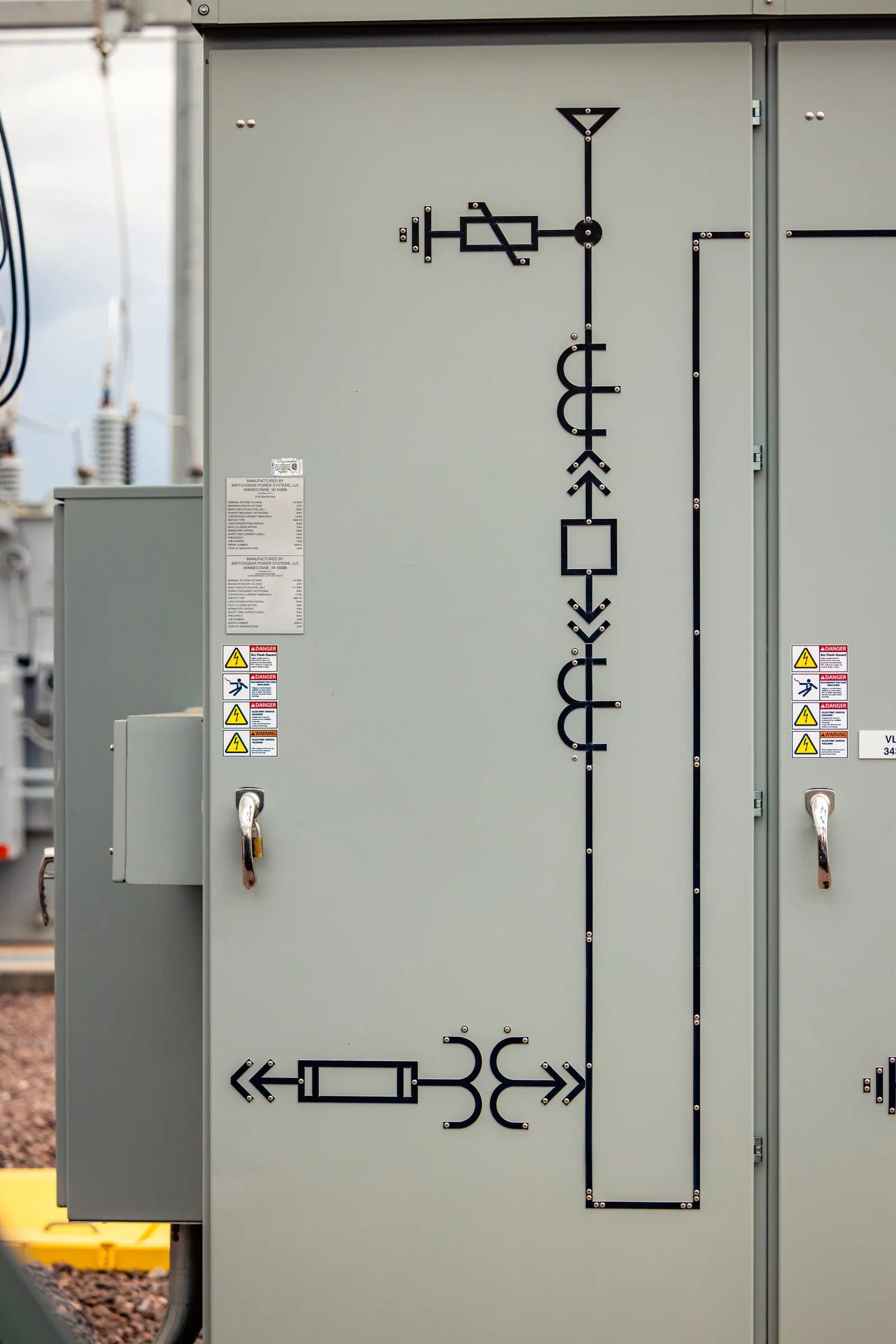 An electrical diagram marked on the door of a substation equipment cabinet